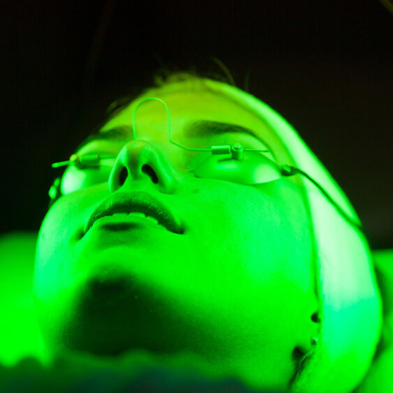 A person with green light on their face