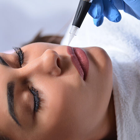 A woman getting her lips waxed at the spa